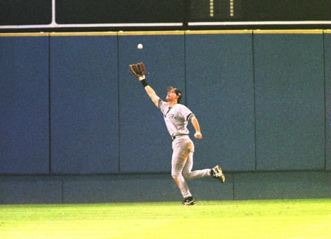 Outfielder Paul O’Neill #21 of the New York Yankees chases down Luis Polonia’s hit for the final out of the Yankees 1-0 victory over the Atlanta Braves in game 5 of the World Series on October 24, 1996, at Fulton County Stadium in Atlanta, Georgia. (Photo by Stephen Dunn/Getty Images)