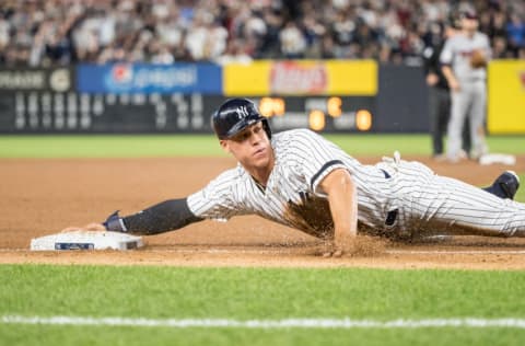 Aaron Judge #99 of the New York Yankees slides against the Minnesota Twins during the American League Wild Card Game at Yankee Stadium on October 3, 2017 in the Bronx borough of New York City. (Photo by Brace Hemmelgarn/Minnesota Twins/Getty Images)*** Local Caption *** Aaron Judge