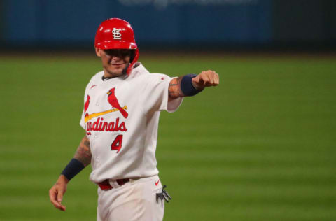 ST LOUIS, MO - SEPTEMBER 24: Yadier Molina #4 of the St. Louis Cardinals acknowledges his teammates in the dugout after recording his 2,000th career hit with a single against the Milwaukee Brewers in the seventh inning at Busch Stadium on September 24, 2020 in St Louis, Missouri. (Photo by Dilip Vishwanat/Getty Images)