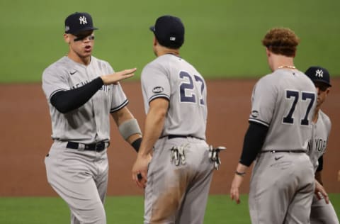 SAN DIEGO, CALIFORNIA - OCTOBER 05: Aaron Judge #99 celebrates with Giancarlo Stanton #27 of the New York Yankees after beating the Tampa Bay Rays 9-3 in Game One of the American League Division Series at PETCO Park on October 05, 2020 in San Diego, California. (Photo by Christian Petersen/Getty Images)