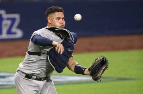 SAN DIEGO, CALIFORNIA - OCTOBER 06: Gary Sanchez #24 of the New York Yankees throws out the runner against the Tampa Bay Rays during the fifth inning in Game Two of the American League Division Series at PETCO Park on October 06, 2020 in San Diego, California. (Photo by Christian Petersen/Getty Images)