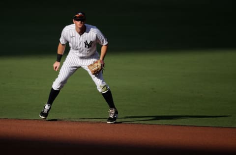 SAN DIEGO, CALIFORNIA - OCTOBER 07: DJ LeMahieu #26 of the New York Yankees fields in Game Three of the American League Division Series against the Tampa Bay Rays at PETCO Park on October 07, 2020 in San Diego, California. The Rays defeated the Yankees 8-4. (Photo by Christian Petersen/Getty Images)