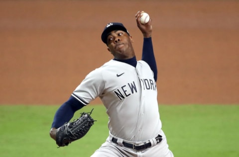 SAN DIEGO, CALIFORNIA - OCTOBER 09: Aroldis Chapman #54 of the New York Yankees delivers the pitch against the Tampa Bay Rays during the seventh inning in Game Five of the American League Division Series at PETCO Park on October 09, 2020 in San Diego, California. (Photo by Sean M. Haffey/Getty Images)