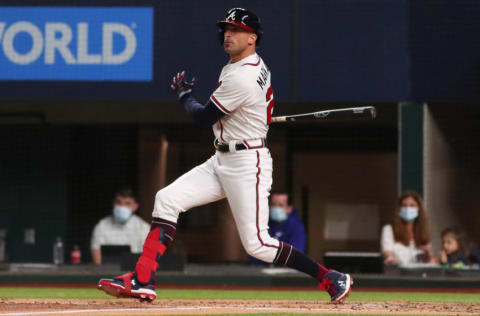 ARLINGTON, TEXAS - OCTOBER 16: Nick Markakis #22 of the Atlanta Braves hits a single against the Los Angeles Dodgers during the second inning in Game Five of the National League Championship Series at Globe Life Field on October 16, 2020 in Arlington, Texas. (Photo by Tom Pennington/Getty Images)