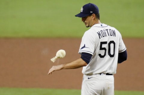 SAN DIEGO, CALIFORNIA - OCTOBER 17: Charlie Morton #50 of the Tampa Bay Rays reacts to walking Martin Maldonado #15 of the Houston Astros during the sixth inning in Game Seven of the American League Championship Series at PETCO Park on October 17, 2020 in San Diego, California. (Photo by Harry How/Getty Images)