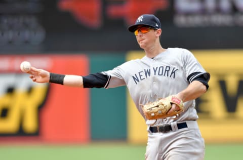 CLEVELAND, OHIO - JUNE 09: DJ LeMahieu #26 of the New York Yankees throws out Francisco Lindor #12 of the Cleveland Indians to end the seventh inning at Progressive Field on June 09, 2019 in Cleveland, Ohio. (Photo by Jason Miller/Getty Images)