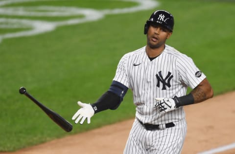 NEW YORK, NEW YORK - SEPTEMBER 25: Aaron Hicks #31 of the New York Yankees tosses his bat as he is walked to first during the first inning against the Miami Marlins at Yankee Stadium on September 25, 2020 in the Bronx borough of New York City. (Photo by Sarah Stier/Getty Images)