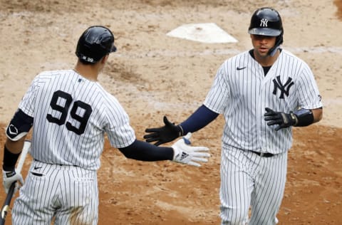 NEW YORK, NEW YORK - SEPTEMBER 26: (NEW YORK DAILIES OUT) Gary Sanchez #24 and Aaron Judge #99 of the New York Yankees in action against the Miami Marlins at Yankee Stadium on September 26, 2020 in New York City. The Yankees defeated the Marlins 11-4. (Photo by Jim McIsaac/Getty Images)