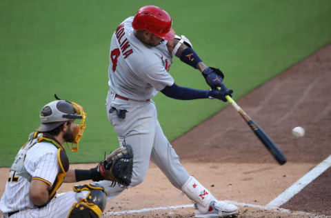 SAN DIEGO, CALIFORNIA - OCTOBER 02: Yadier Molina #4 of the St. Louis Cardinals hits a fly ball against the San Diego Padres during the fourth inning of Game Three of the National League Wild Card Series at PETCO Park on October 02, 2020 in San Diego, California. (Photo by Sean M. Haffey/Getty Images)