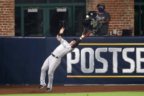 SAN DIEGO, CALIFORNIA – OCTOBER 06: Clint Frazier #77 of the New York Yankees catches a fly ball against the Tampa Bay Rays during the fourth inning in Game Two of the American League Division Series at PETCO Park on October 06, 2020 in San Diego, California. (Photo by Christian Petersen/Getty Images)