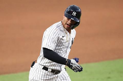 SAN DIEGO, CALIFORNIA - OCTOBER 08: Gleyber Torres #25 of the New York Yankees celebrates after hitting a two run home run against the Tampa Bay Rays in Game Four of the American League Division Series at PETCO Park on October 08, 2020 in San Diego, California. (Photo by Sean M. Haffey/Getty Images)