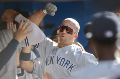 TORONTO, ON - SEPTEMBER 14: Brett Gardner #11 of the New York Yankees celebrates a three run home run in the dugout during the fifth inning of their MLB game against the Toronto Blue Jays at Rogers Centre on September 14, 2019 in Toronto, Canada. (Photo by Cole Burston/Getty Images)