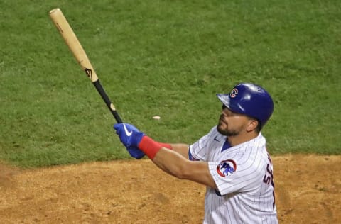 CHICAGO, ILLINOIS - AUGUST 01: Kyle Schwarber #12 of the Chicago Cubs hits a two run home run in the 8th inning against the Pittsburgh Pirates at Wrigley Field on August 01, 2020 in Chicago, Illinois. (Photo by Jonathan Daniel/Getty Images)