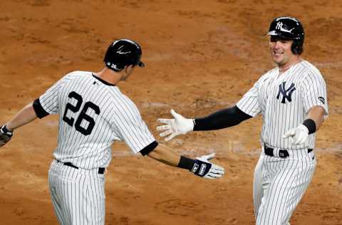 NEW YORK, NEW YORK - SEPTEMBER 15: (NEW YORK DALIES OUT) Luke Voit #59 and DJ LeMahieu #26 of the New York Yankees celebrate against the Toronto Blue Jays at Yankee Stadium on September 15, 2020 in New York City. The Yankees defeated the Blue Jays 20-6. (Photo by Jim McIsaac/Getty Images)