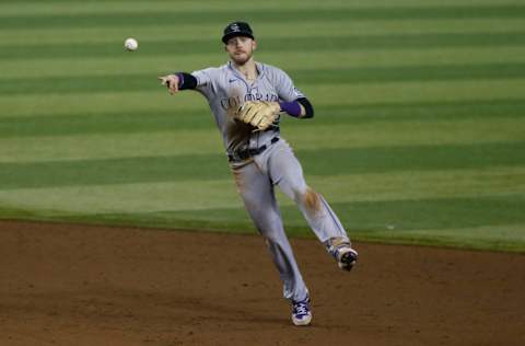 PHOENIX, ARIZONA - SEPTEMBER 26: Shortstop Trevor Story #27 of the Colorado Rockies throws to first base on a ground ball hit by Jon Jay #9 of the Arizona Diamondbacks during the ninth inning of the MLB game at Chase Field on September 26, 2020 in Phoenix, Arizona. (Photo by Ralph Freso/Getty Images)