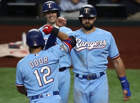 Rougned Odor #12 of the Texas Rangers celebrates with Joey Gallo #13 and Nick Solak #15 (Photo by Ronald Martinez/Getty Images)