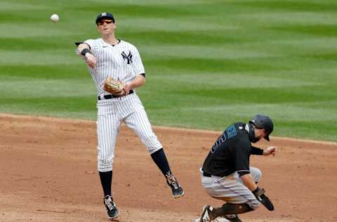 NEW YORK, NEW YORK - SEPTEMBER 26: (NEW YORK DAILIES OUT) DJ LeMahieu #26 of the New York Yankees in action against Jon Berti #5 of the Miami Marlins at Yankee Stadium on September 26, 2020 in New York City. The Yankees defeated the Marlins 11-4. (Photo by Jim McIsaac/Getty Images)