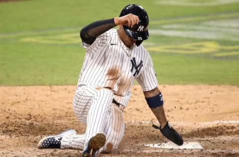 SAN DIEGO, CALIFORNIA - OCTOBER 08: Gleyber Torres #25 of the New York Yankees scores a run against the Tampa Bay Rays during the eighth inning in Game Four of the American League Division Series at PETCO Park on October 08, 2020 in San Diego, California. (Photo by Christian Petersen/Getty Images)