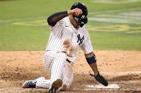 SAN DIEGO, CALIFORNIA - OCTOBER 08: Gleyber Torres #25 of the New York Yankees scores a run against the Tampa Bay Rays during the eighth inning in Game Four of the American League Division Series at PETCO Park on October 08, 2020 in San Diego, California. (Photo by Christian Petersen/Getty Images)