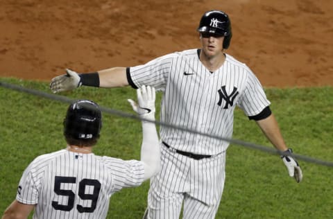 NEW YORK, NEW YORK - SEPTEMBER 17: (NEW YORK DAILIES OUT) DJ LeMahieu #26 of the New York Yankees celebrates his fourth inning home run against the Toronto Blue Jays with teammate Luke Voit #59 at Yankee Stadium on September 17, 2020 in New York City. The Yankees defeated the Blue Jays 10-7. (Photo by Jim McIsaac/Getty Images)