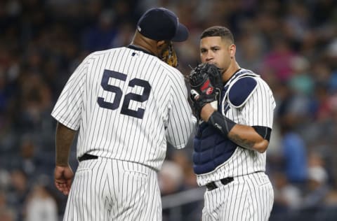 NEW YORK, NY - AUGUST 31: Pitcher CC Sabathia #52 and Gary Sanchez #24 of the New York Yankees in action during a game against the Boston Red Sox at Yankee Stadium on August 31, 2017 in the Bronx borough of New York City. (Photo by Rich Schultz/Getty Images)