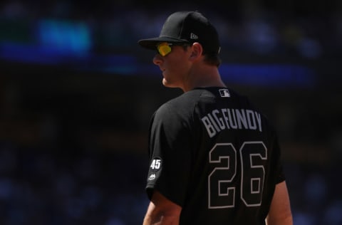 LOS ANGELES, CALIFORNIA - AUGUST 24: DJ LeMahieu #26 of the New York Yankees looks on first base during the sixth inning of the MLB game at Dodger Stadium on August 24, 2019 in Los Angeles, California. Teams are wearing special color-schemed uniforms with players choosing nicknames to display for Players' Weekend. The Dodgers defeated the Yankees 2-1. (Photo by Victor Decolongon/Getty Images)