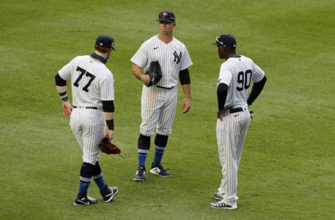 NEW YORK, NEW YORK - AUGUST 28: (NEW YORK DAILIES OUT) Clint Frazier #77, Brett Gardner #11 and Estevan Florial #90 of the New York Yankees during a game against the New York Mets at Yankee Stadium on August 28, 2020 in New York City. The Mets defeated the Yankees 6-4. (Photo by Jim McIsaac/Getty Images)