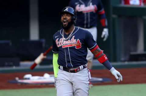 ARLINGTON, TEXAS - OCTOBER 17: Marcell Ozuna #20 of the Atlanta Braves reacts against the Los Angeles Dodgers during the seventh inning in Game Six of the National League Championship Series at Globe Life Field on October 17, 2020 in Arlington, Texas. (Photo by Tom Pennington/Getty Images)