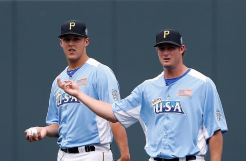 KANSAS CITY, MO - JULY 08: Pitchers Jameson Taillon and Gerrit Cole look on during warm ups prior to the SiriusXM All-Star Futures Game at Kauffman Stadium on July 8, 2012 in Kansas City, Missouri. (Photo by Jamie Squire/Getty Images)