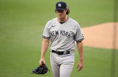 SAN DIEGO, CALIFORNIA - OCTOBER 05: Gerrit Cole #45 of the New York Yankees walks off the mound at the end of the first inning against the Tampa Bay Rays in Game One of the American League Division Series at PETCO Park on October 05, 2020 in San Diego, California. (Photo by Christian Petersen/Getty Images)