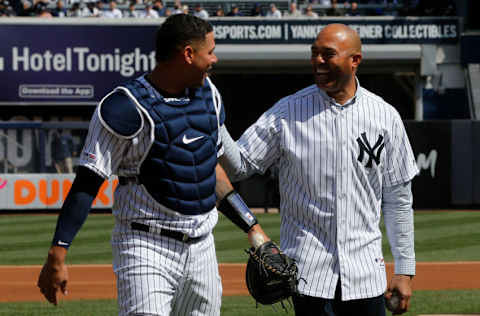 NEW YORK, NY - MARCH 28: (NEW YORK DAILIES OUT) Former New York Yankee Mariano Rivera has a laugh with Gary Sanchez #24 after throwing the ceremonial first pitch during Opening Day against the Baltimore Orioles at Yankee Stadium on March 28, 2019 in the Bronx borough of New York City. The Yankees defeated the Orioles 7-2. (Photo by Jim McIsaac/Getty Images)