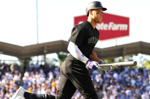 LOS ANGELES, CA - AUGUST 25: Aaron Judge #99 of the New York Yankees rounds the bases after hitting a solo home run in the third inning of the game against the Los Angeles Dodgers at Dodger Stadium on August 25, 2019 in Los Angeles, California. Teams are wearing special color schemed uniforms with players choosing nicknames to display for Players' Weekend. (Photo by Jayne Kamin-Oncea/Getty Images)