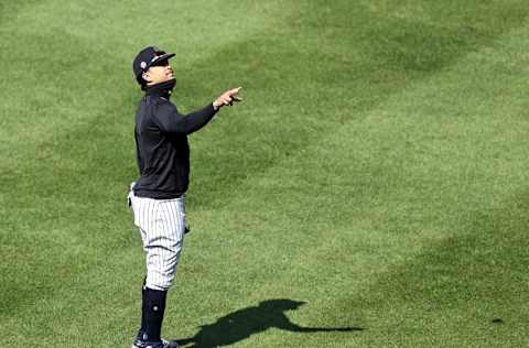 NEW YORK, NEW YORK - JULY 04: Giancarlo Stanton #27 of the New York Yankees warms up in the outfield during summer workouts at Yankee Stadium on July 04, 2020 in the Bronx borough of New York City. (Photo by Elsa/Getty Images)