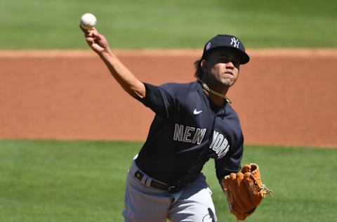 CLEARWATER, FLORIDA - MARCH 04: Deivi García #83 of the New York Yankees delivers a pitch in the first inning against the Philadelphia Phillies in a spring training game at BayCare Ballpark on March 04, 2021 in Clearwater, Florida. (Photo by Mark Brown/Getty Images)