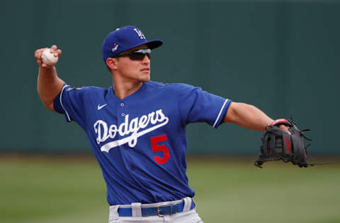 SURPRISE, ARIZONA - MARCH 07: Shortstop Corey Seager #5 of the Los Angeles Dodgers throws during the fifth inning of the MLB spring training baseball game against the Texas Rangers at Surprise Stadium on March 07, 2021 in Surprise, Arizona. (Photo by Ralph Freso/Getty Images)