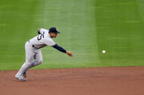 BUFFALO, NEW YORK - SEPTEMBER 08: Gleyber Torres #25 of the New York Yankees looks to turn a double play on a ball hit by Rowdy Tellez #44 of the Toronto Blue Jays during the first inning at Sahlen Field on September 08, 2020 in Buffalo, New York. The Blue Jays are the home team and are playing their home games in Buffalo due to the Canadian government’s policy on coronavirus (COVID-19). (Photo by Bryan M. Bennett/Getty Images)