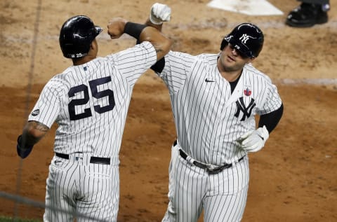 NEW YORK, NEW YORK – AUGUST 16: (NEW YORK DAILIES OUT) Mike Ford #72 and Gleyber Torres #25 of the New York Yankees in action against the Boston Red Sox at Yankee Stadium on August 16, 2020 in New York City. The Yankees defeated the Red Sox 4-2. (Photo by Jim McIsaac/Getty Images)