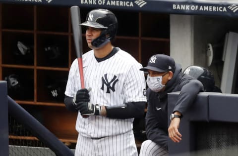 NEW YORK, NEW YORK - APRIL 01: (NEW YORK DAILIES OUT) Gary Sanchez #24 and manager Aaron Boone of the New York Yankees look on against the Toronto Blue Jays at Yankee Stadium on April 01, 2021 in New York City. The Blue Jays defeated the Yankees 3-2 in ten innings. (Photo by Jim McIsaac/Getty Images)