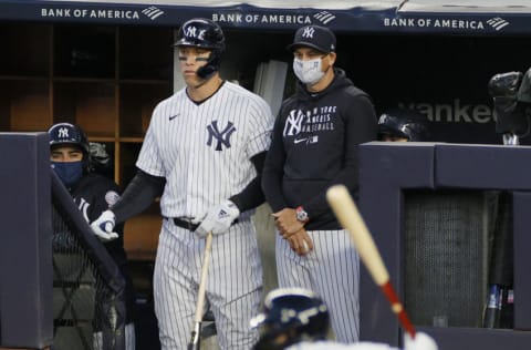 NEW YORK, NEW YORK - APRIL 06: Manager Aaron Boone #17 of the New York Yankees and Aaron Judge #99 watch from the dugout during the second inning against the Baltimore Orioles at Yankee Stadium on April 06, 2021 in the Bronx borough of New York City. (Photo by Sarah Stier/Getty Images)