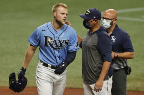 ST PETERSBURG, FLORIDA - APRIL 11: Austin Meadows #17 of the Tampa Bay Rays is looked at by manager Kevin Cash #16 after being hit by a pitch during the first inning against the New York Yankees at Tropicana Field on April 11, 2021 in St Petersburg, Florida. (Photo by Douglas P. DeFelice/Getty Images)