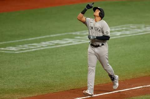 ST PETERSBURG, FLORIDA - APRIL 11: Gio Urshela #29 of the New York Yankees reacts after hitting a two-run home run during the third inning against the Tampa Bay Rays at Tropicana Field on April 11, 2021 in St Petersburg, Florida. (Photo by Douglas P. DeFelice/Getty Images)