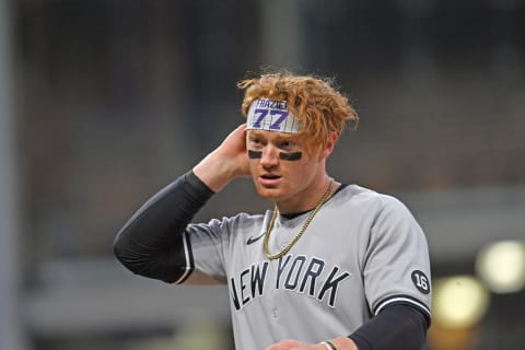 CLEVELAND, OHIO – APRIL 22: Clint Frazier #77 of the New York Yankees walks off the field after the top of the 6th inning against the Cleveland Indians at Progressive Field on April 22, 2021 in Cleveland, Ohio. (Photo by Jason Miller/Getty Images)