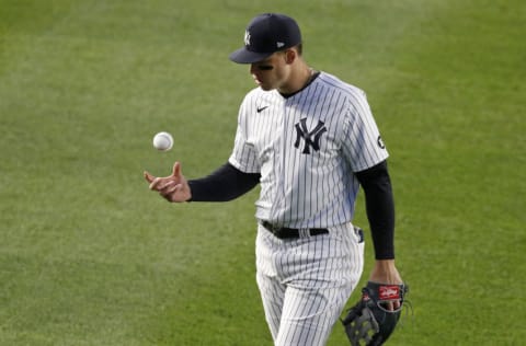 NEW YORK, NEW YORK - APRIL 21: (NEW YORK DAILIES OUT) Aaron Judge #99 of the New York Yankees warms up between innings against the Atlanta Braves at Yankee Stadium on April 21, 2021 in New York City. The Braves defeated the Yankees 4-1. (Photo by Jim McIsaac/Getty Images)