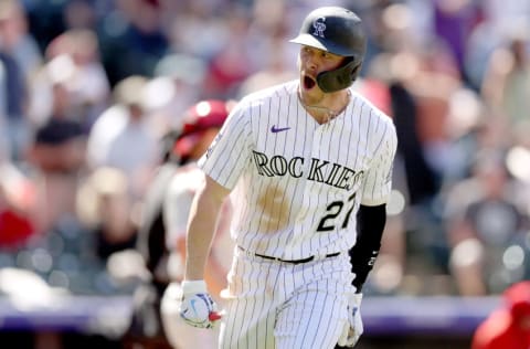 DENVER, COLORADO - APRIL 25: Trevor Story #27 of the Colorado Rockies celebrates after hitting a grand slam home run against the Philadelphia Phillies in the fourth inning at Coors Field on April 25, 2021 in Denver, Colorado. (Photo by Matthew Stockman/Getty Images)