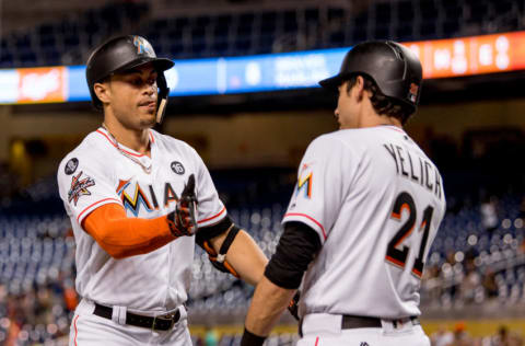 MIAMI, FL - SEPTEMBER 28: Giancarlo Stanton #27 of the Miami Marlins celebrates with Christian Yelich #21 after hitting his fifty-ninth home run of the season during the eighth inning of the game against the Atlanta Braves at Marlins Park on September 28, 2017 in Miami, Florida. (Photo by Rob Foldy/Miami Marlins via Getty Images)