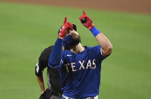 SAN DIEGO, CA - AUGUST 19: Joey Gallo #13 of the Texas Rangers points skyward after hitting a solo home run during the ninth inning against the San Diego Padres at Petco Park on August 19, 2020 in San Diego, California. (Photo by Denis Poroy/Getty Images)