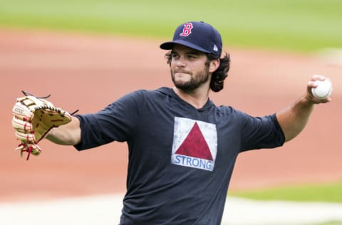 BOSTON, MA - JULY 03: Andrew Benintendi #16 of the Boston Red Sox warms up during Summer Workouts at Fenway Park on July 3, 2020 in Boston, Massachusetts. (Photo by Adam Glanzman/Getty Images)