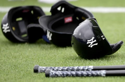 DUNEDIN, FLORIDA - MARCH 21: General view of the glove and hat of bats and helmets of the New York Yankees prior to the game between the Toronto Blue Jays and the Detroit Tigers during a spring training game at TD Ballpark on March 21, 2021 in Dunedin, Florida. (Photo by Douglas P. DeFelice/Getty Images)