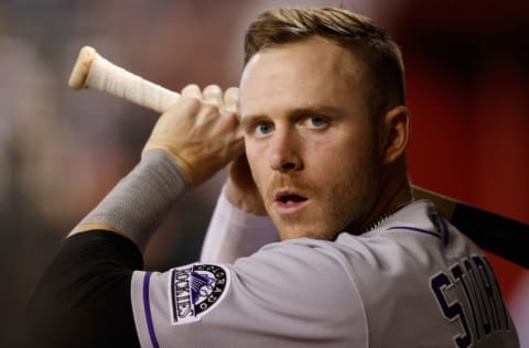 PHOENIX, ARIZONA - MAY 01: Trevor Story #27 of the Colorado Rockies warms up in the dugout during the MLB game against the Arizona Diamondbacks at Chase Field on May 01, 2021 in Phoenix, Arizona. The Rockies defeated the Diamondbacks 14-6. (Photo by Christian Petersen/Getty Images)