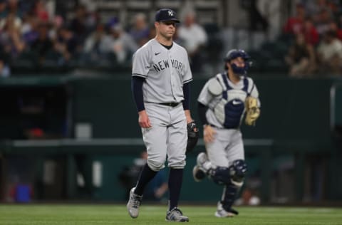 ARLINGTON, TEXAS - MAY 19: Corey Kluber #28 of the New York Yankees after the third out against the Texas Rangers in the seventh inning at Globe Life Field on May 19, 2021 in Arlington, Texas. (Photo by Ronald Martinez/Getty Images)